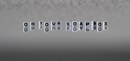 Wall Mural - on your soapbox word or concept represented by black and white letter cubes on a grey horizon background stretching to infinity