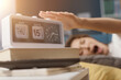 © StockPhotoPro - Woman waking up and turning off the alarm