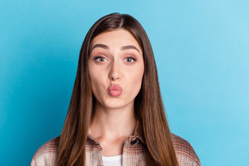 Poster - Photo of adorable charming person kiss pouted lips look camera isolated on blue color background