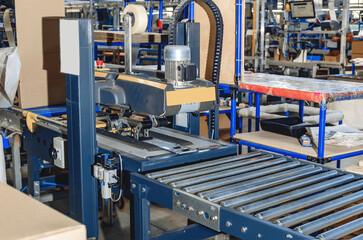 Cardboard packaging machine. Production line of packaging. Industry.