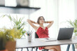 © StockPhotoPro - Woman sitting at desk and relaxing