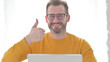 © stockbakers - Portrait of Man with Laptop Showing Thumbs Up