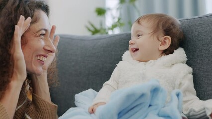 Wall Mural - Family, mother and baby being funny with game, crazy together and comic with smile in living room in home. Love, care and happiness while playing peekaboo with young and happy child and mom at house