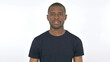 © stockbakers - Serious Young African Man Looking at the Camera on White Background