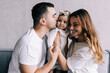 © F8  \ Suport Ukraine - Parenthood and people concept - happy mother, father and baby daughter playing at home
