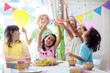 © famveldman - Kids birthday party. Children with cake and gifts