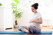 © famveldman - Pregnancy yoga. Exercise for pregnant woman.