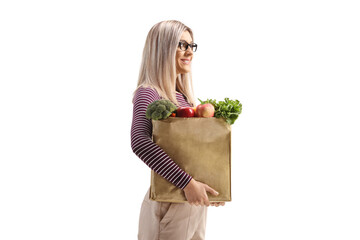 Poster - Profile shot of a woman with a bag of groceries