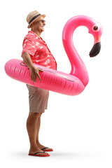 Wall Mural - Ful length profile shot of a mature tourist with a inflatable flamingo rubber ring
