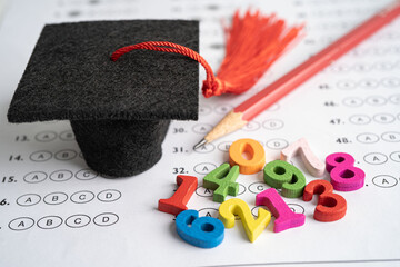 math number colorful with graduation hat and pencil on answer sheet background, education study math