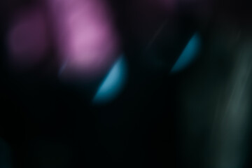 Wall Mural - blur light leak. lens flare. bokeh rays. defocused purple blue color flecks glow on dark night black
