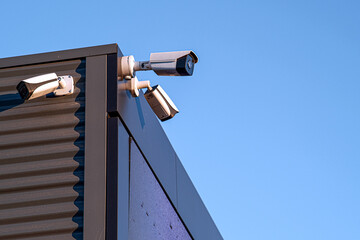 A review of surveillance cameras on white background. Security concept. Facial recognition. Program search for criminals.