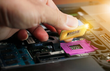 hand of computer engineering brings computer cpu processor memory change components into socket proc