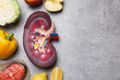 © New Africa - Flat lay composition with kidney model and different products on grey table, space for text