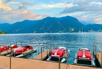 Wall Mural - retro red boats on the Lugano lake in Switzerland