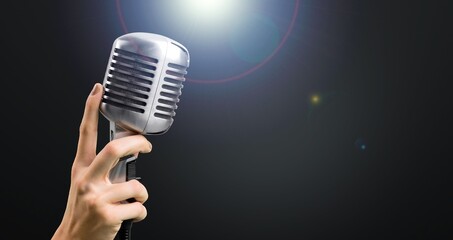 Sticker - Classic black microphone with stage lighting background