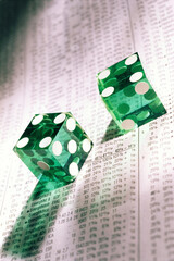 Pair of dice on a financial report