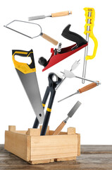 Sticker - Different carpenter's tools falling into wooden box on white background