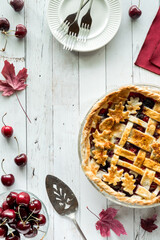 Wall Mural - Top down view of a fall themed cherry pie with copy space to the left.