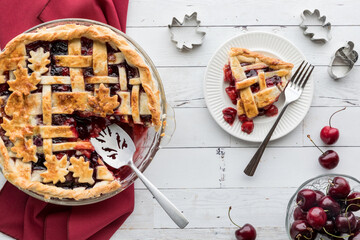 Wall Mural - A delicious cherry pie fresh out of the oven with one slice to the right.