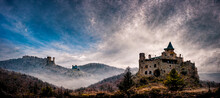 3D Rendering Of A Lonely Abandoned Castle In The Mountains With Dramatic Sky Background