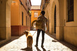 Young Hispanic man on his back with his dog holding the leash walking on a sunny street at sunset. Concept animals, dogs, love, pets, golden.
