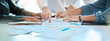 © Malik E/peopleimages.com - Business teamwork hands, paperwork graphs and planning annual report data, research and office budget. Company discussion with documents in strategy meeting, analytics progress and financial stats