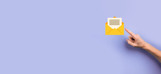 Businessman hand holding letter icon,email icons.Contact us by newsletter email and protect your personal information from spam mail.Customer service call center contact us.Email marketing newsletter.