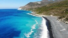 Drone Flies Over Nonza Beach With Black Sand In Corsica
