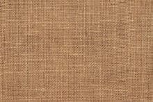 Brown Burlap Cloth Background Or Sack Cloth For Packing. Natural Linen Threads Texture. Sackcloth, Empty Space. Wrapping Detail, Old Grainy Cotton Backdrop Close-up.