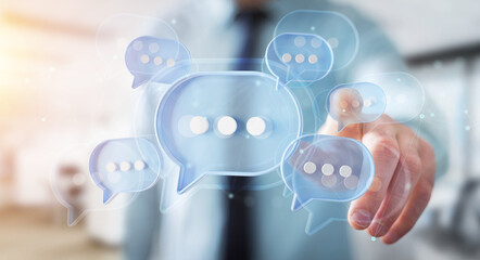 Wall Mural - Man touching with his fingers digital speech bubbles talk icons. Minimal conversation or social media messages floating in front of businessman hand. 3D rendering
