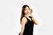 © CREATIVE WONDER - Young pretty asian woman long hair style in black dress posing on white background.