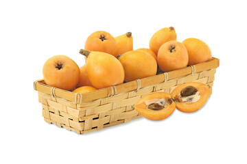 Wall Mural - Loquat  in wicker basket isolated on white