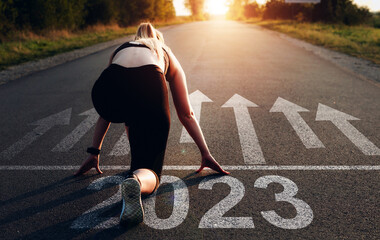 Fototapete - Sporty girl waiting to start the new year 2023.	
New Year 2023 with new ambitions, challenge, plans, goals and visions.