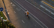 Man bicycling on cycling road. Top aerial view.