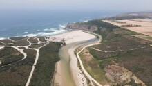 Aerial view of Praia de Odeceixe, a beautiful beach facing the Atlantic Ocean in Alentejo region, Portugal.