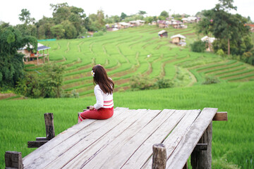 Canvas Print - girl sitting on a bench