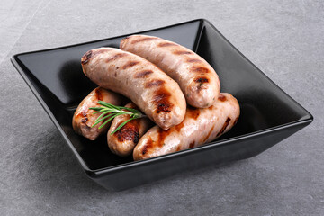 Wall Mural - Grilled German, Munich, Bavarian, sausages on gray background.