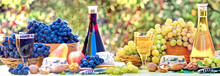 Wine, Grapes And Cheese On The Table, Enjoying The Flavors Of The Autumn Harvest
 