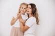 © kuzmichstudio - Family mother and daughter, beautiful and happy together, portrait on a white background