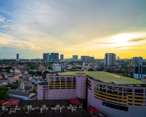 Melaka, Malaysia - Aug 25, 2022 Panoramic view of city skyline, traffic and light during sunset.