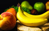 Fototapeta Kuchnia - Bananas and peaches on the background of other fruits. Shallow depth of field