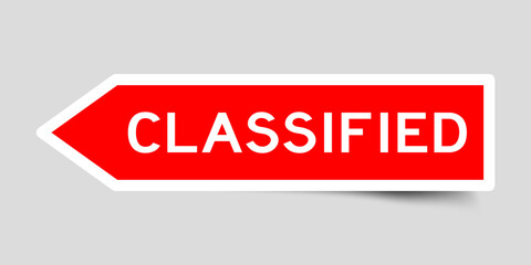 Wall Mural - Red color arrow shape sticker label with word classified on gray background