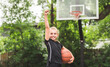 © Louis-Paul Photo - portrait of a kid girl playing with a basketball in park