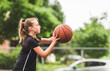 © Louis-Paul Photo - portrait of a kid girl playing with a basketball in park