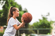 © Louis-Paul Photo - portrait of a kid girl playing with a basketball in park