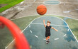 © Louis-Paul Photo - portrait of a kid girl playing with a basketball in park