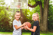 © Louis-Paul Photo - two girl child in sportswear playing basketball game