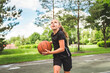 © Louis-Paul Photo - girl with basketball on court on summer season