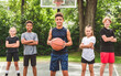 © Louis-Paul Photo - great child Team in sportswear playing basketball game